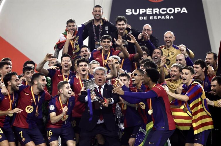 FC Barcelona's President Joan Laporta (C) and players celebrate their victory following the Spanish SuperCup final match between Real Madrid and FC Barcelona at Abdulla King's Sports Complex of Jeddah, Saudi Arabia,12 January 2025. EFE/ Alberto Estevez