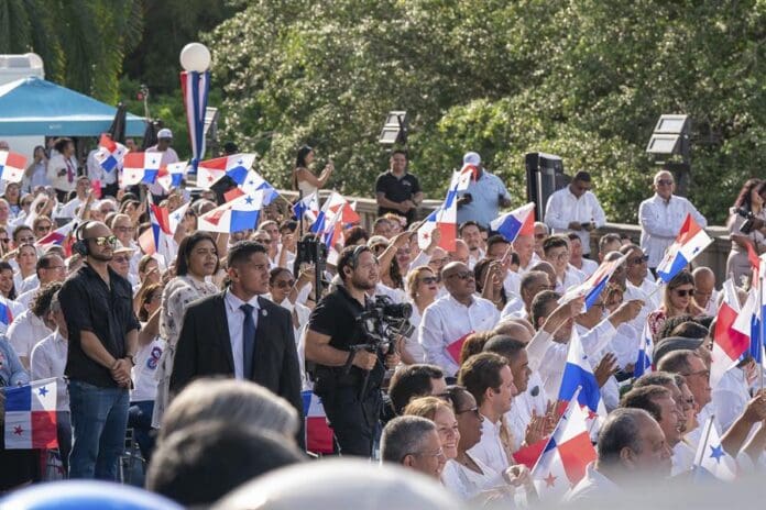 Citizens wave the Panamanian flag at the commemorative ceremony for the 25 years of the transfer of the Panama Canal at the Canal Administration building in Panama City, Panama, Dec. 31, 2024. EFE/ Eliecer Aizprua Banfield