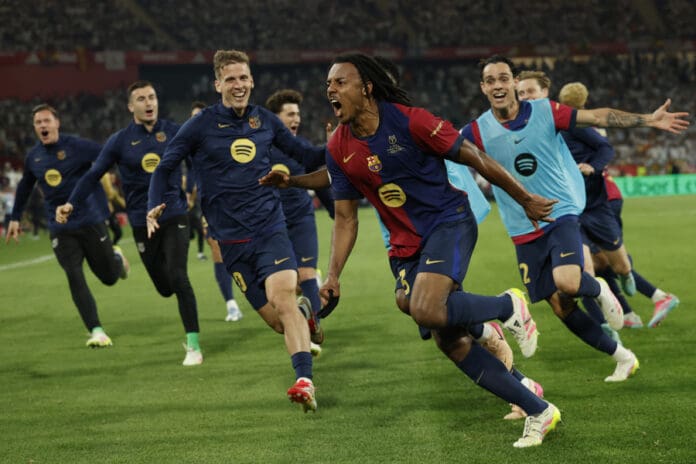 FC Barcelona's Jules Koundé (2R) celebrates after scoring goal during the Spanish King's Cup final soccer match between FC Barcelona and Real Madrid at La Cartuja stadium, in Sevilla, Andalusia, Spain. April 26, 2025. EFE/Julio Munoz