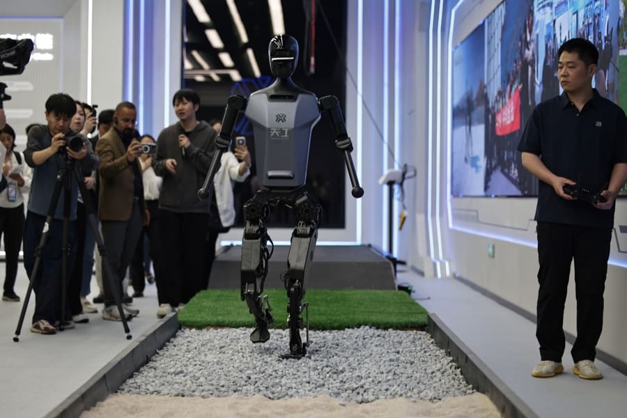(FILE) - A robot walks at the Beijing Humanoid Robot Innovation Center in Beijing, China, May 16, 2025.. EFE/EPA/ANDRES MARTINEZ CASARES