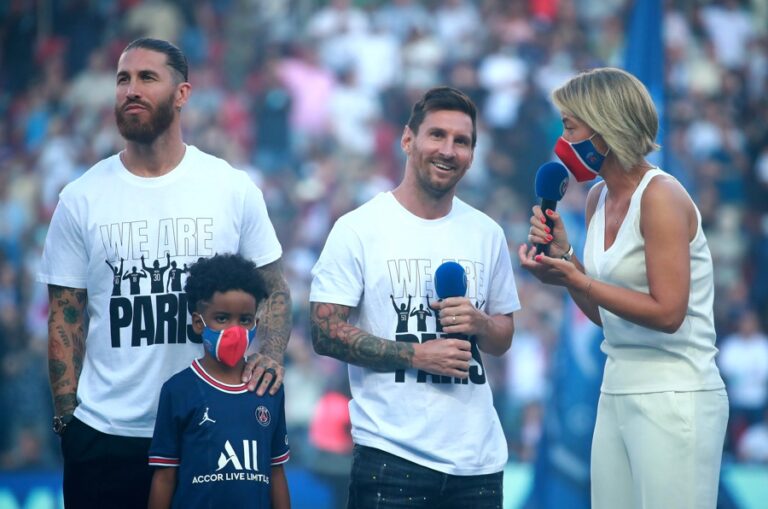 Lionel Messi (C) and Sergio Ramos (L) react during their presentation at the Parc des Princes stadium in Paris, France, 14 August 2021. EFE-EPA/CHRISTOPHE PETIT TESSON