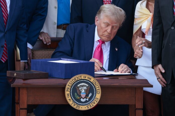 US President Donald J. Trump, with lawmakers, signs his 'Big Beautiful Bill' into law during the Independence Day Military Family Picnic on the South Lawn of the White House in Washington, DC, US, Jul. 04, 2025. EFE/EPA/SHAWN THEW