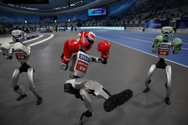 Humanoid robots show their skills after the Free fight Final match during the 2025 World Humanoid Robot Games in the National Speed Skating Oval in Beijing, China, 17 August 2025. EFE-EPA/ANDRES MARTINEZ CASARES