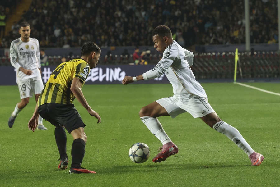 Damir Kassabulat (C) of Kairat Almaty in action against Kylian Mbappe of Real Madrid during the UEFA Champions League soccer match between Kairat Almaty and Real Madrid, in Almaty, Kazakhstan, Sep. 30, 2025. EFE/EPA/MAXIM SHIPENKOV