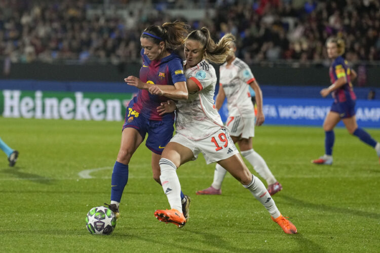 FC Barcelona's Aitana Bonmati (L) in action against Bayern Munich's Kathleen Krüger during a UEFA Champions League soccer match between FC Barcelona and Bayern Munich in Barcelona, Spain. October 07, 2025. EFE/ Alejandro Garcia