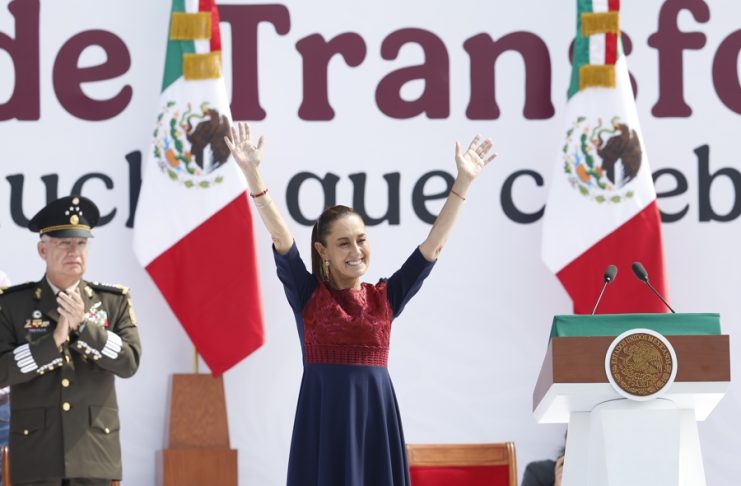 Mexican President Claudia Sheinbaum waves during the celebration of the seventh anniversary of the so-called Fourth Transformation on the esplanade of the Zocalo in Mexico City, Mexico, Dec. 6, 2025. EFE/ Sáshenka Gutierrez