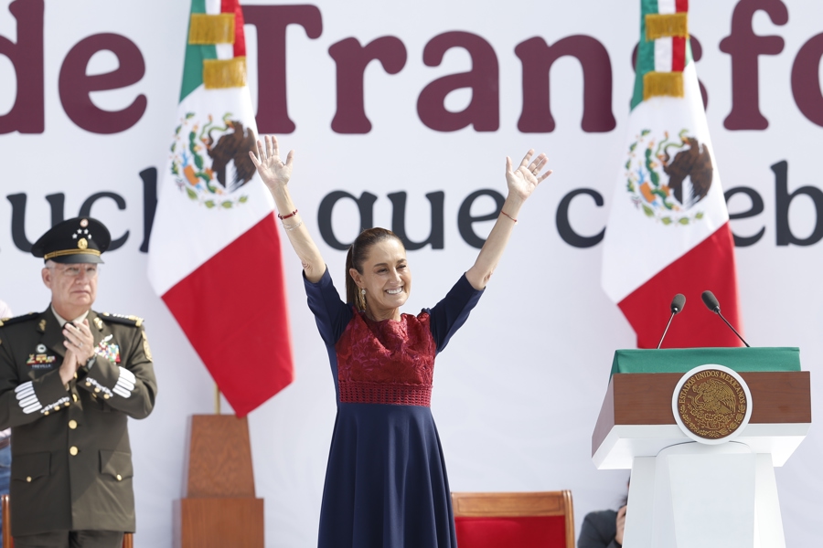 Mexican President Claudia Sheinbaum waves during the celebration of the seventh anniversary of the so-called Fourth Transformation on the esplanade of the Zocalo in Mexico City, Mexico, Dec. 6, 2025. EFE/ Sáshenka Gutierrez