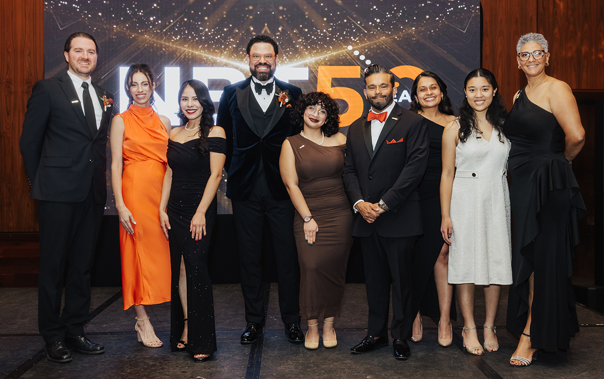 Photo courtesy of New Brunswick Tomorrow. (l-r) 1. Charles Bergman – Senior Director, Neighborhood Strategies 2. Jessica Viscuso – Director of Administration 3. Diana Tapia Diaz – Associate Director of Housing 4. Jaymie Santiago – President 5. Abigail Reynoso – Administration & Communications Associate 6. Manuel Castañeda – Vice President of Operations 7. Jharline Iglesias – Associate Director of Health Services 8. Arginine Lu – LiveWell Intern 9. Jovanny Belisario – Associate Director of Economic Development