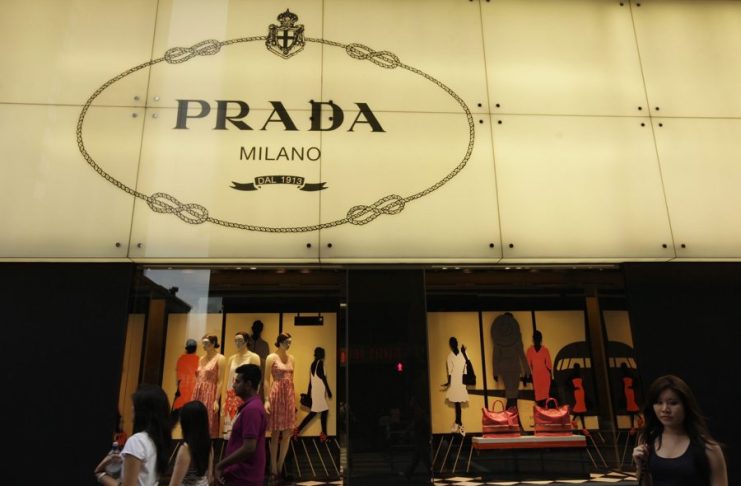 FILE] Several pedestrians walk past a Prada store in Hong Kong. EFE/FILE/Ym Yik