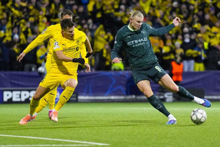 Bodo/Glimt's Jostein Gundersen and Manchester City's Erling Braut Haaland durin the UEFA Champions League soccer match between Bodo/Glimt and Manchester City at Aspmyra Stadium in Bodo, Norway. Jan. 20, 2026. EFE/EPA/Fredrik Varfjell NORWAY OUT