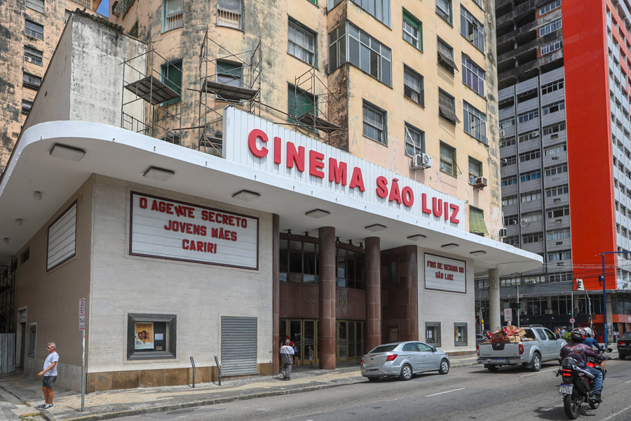 People walk past a theater with a poster for the film The Secret Agent in Recife, Brazil, 24 January 2026 (issued 31 January 2026). The streets of the Brazilian city of Recife have become an open-air film set thanks to The Secret Agent, the four-time Oscar-nominated film that has sparked a wave of film tourism, with visits to the main locations immortalized in the movie. EFE/ Carlos Ezequiel Vanonni