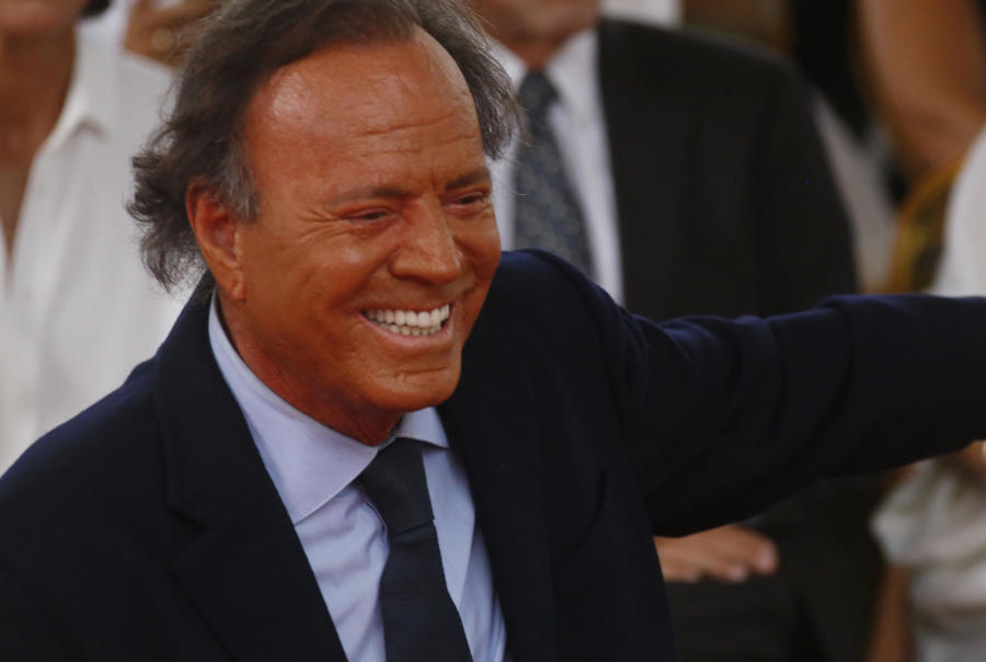 (FILE). Spanish singer Julio Iglesias smiles after unveiling his star on Puerto Rico's Walk of Fame in San Juan on Thursday. Sep. 29, 2016. EFE/Thais Llorca