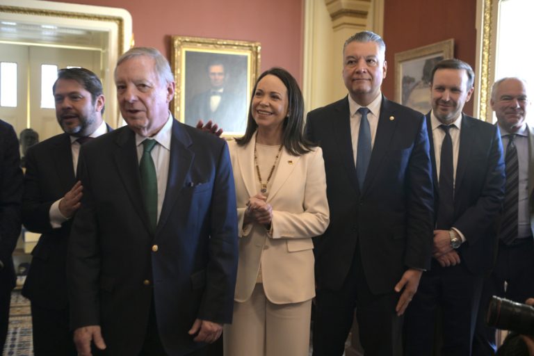 Venezuelan opposition leader and Nobel Peace Prize winner María Corina Machado (center) poses alongside Senators Rubén Gallego (left), Dick Durbin (second from left), and Alex Padilla (second from right) during a visit to the United States Congress on Thursday, January 15, 2026, in Washington, D.C. EFE/Lenin Nolly