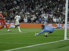 Real Madrid Vinicius Junior (2L) after scoring during the Champions League play-off second leg match between Real Madrid and Benfica at the Santiago Bernabeu stadium in Madrid, Spain. Feb. 25, 2026. EFE/ Juanjo Martin