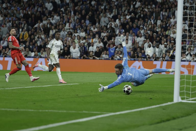 Real Madrid Vinicius Junior (2L) after scoring during the Champions League play-off second leg match between Real Madrid and Benfica at the Santiago Bernabeu stadium in Madrid, Spain. Feb. 25, 2026. EFE/ Juanjo Martin