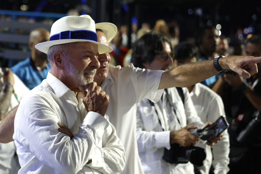 Brazilian President Luiz Inacio Lula da Silva (L) watches alongside Rio de Janeiro Mayor Eduardo Paes (R) the Academicos de Niteroi samba school parade at the Sambadrome in Rio de Janeiro, Brazil, 15 February 2026. EFE/EPA/Antonio Lacerda