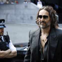 Russell Brand’s trial for alleged sexual offenses is delayed until October.