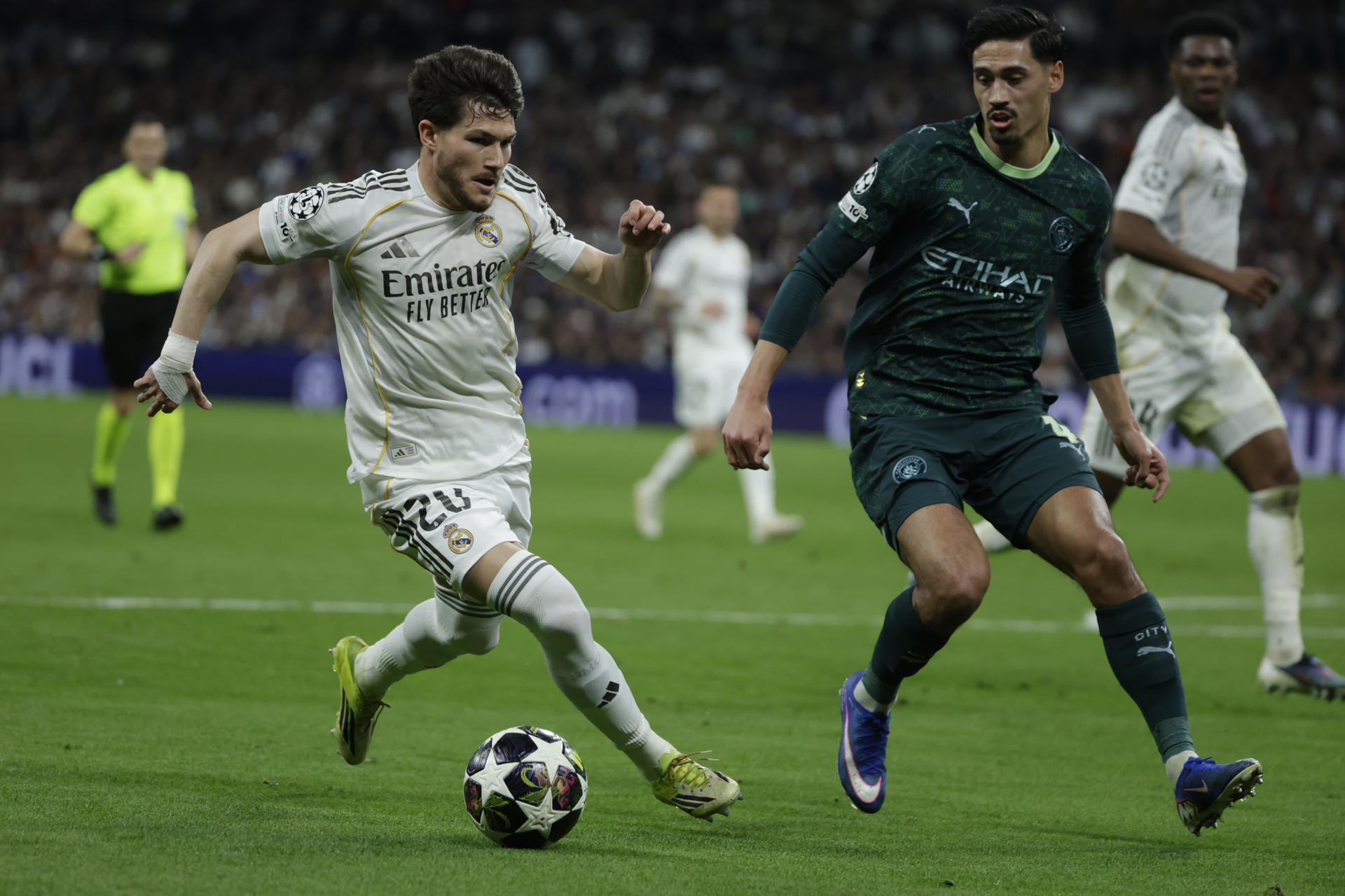 Real Madrid's Francisco Garcia (L) in action against Manchester City's Tijjani Reijnders (R) during the UEFA Champions League round-of-sixteen first leg soccer match between Real Madrid and Manchester City, in Madrid, Spain, 11 March 2026. EFE/ Juanjo Martín
