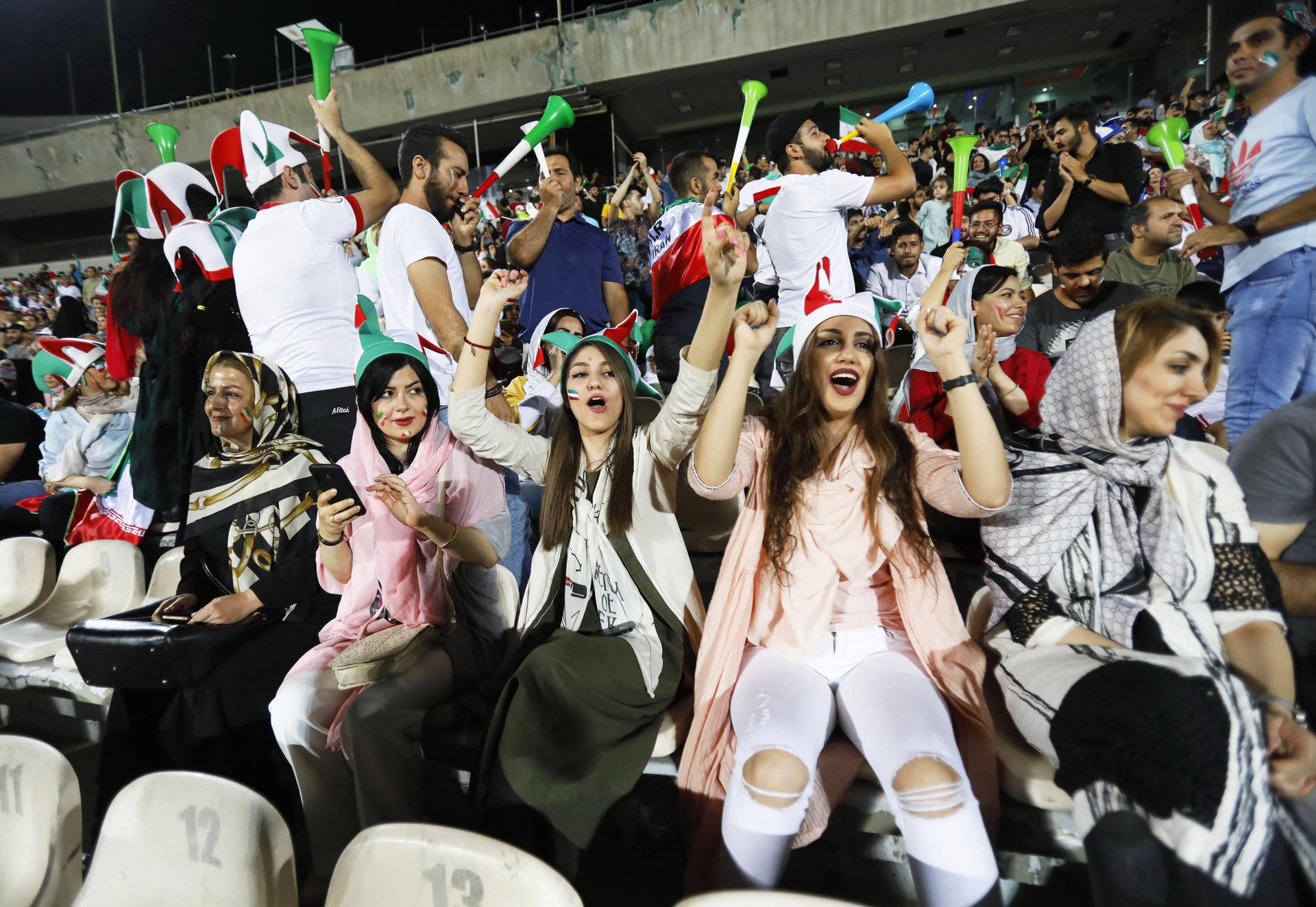 Iranian women and men cheer at the Azadi stadium in Tehran, Iran, 20 June 2018, as they attend the public viewing of the FIFA World Cup 2018 match between Iran and Spain played in Kazan, Russia. EFE-EPA/STR/FILE