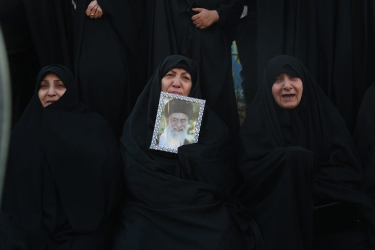 A mourner holds a picture of Iranian Supreme Leader Ayatollah Ali Khamenei following his death; at Enqelab Square in Tehran, Iran, 01 March 2026. EFE-EPA/ABEDIN TAHERKENAREH