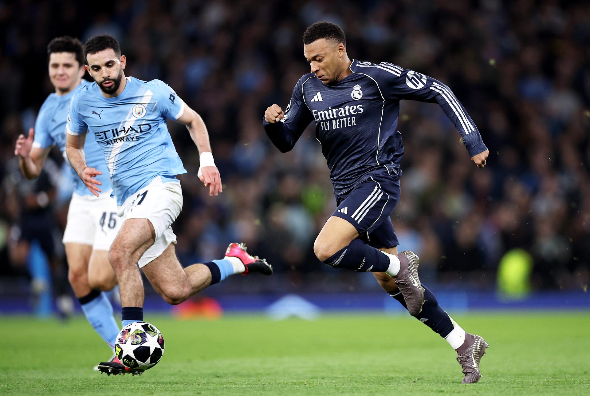 Rayan Aït-Nouri (L) of Manchester City in action against Kylian Mbappe of Real Madrid during the UEFA Champions League Round of 16 2nd leg match between Manchester City and Real Madrid in Manchester, Great Britain, 17 March 2026. EFE/EPA/ADAM VAUGHAN