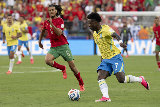 Vinicius Junior (R) of Brazil vies for the ball with Ayyoub Bouaddii of Morocco during a Group C match of the 2026 FIFA World Cup between Brazil and Morocco at MetLife Stadium in New Jersey, USA, 13 June 2026. EFE/Angel Colmenares