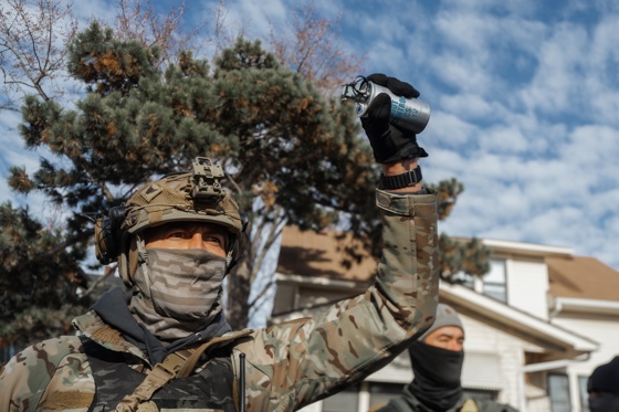 FILE). A US Border Patrol agent holds up a tear gas canister towards residents during a confrontation in Minneapolis, Minnesota, US. Jan. 12, 2026. Jan. 12, 2026. EFE/EPA/OLGA FEDOROVA