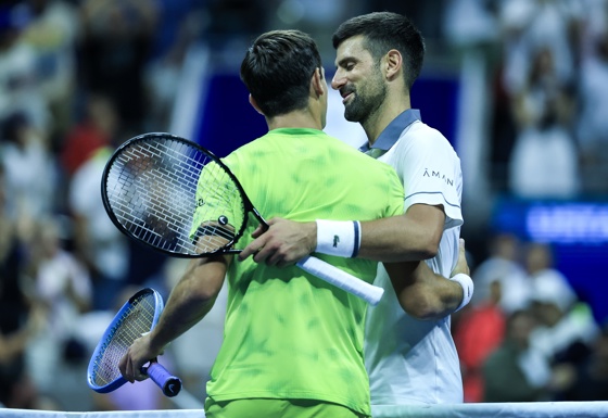 Mariano Navone (L) of Argentina salutes Novak Djokovic of Serbia after winning the Men's Singles round one of the US Open Tennis Championships at the USTA Billie Jean King National Tennis Center in Flushing Meadows, New York, USA, 30 August 2026. EFE-EPA/BRIAN HIRSCHFELD