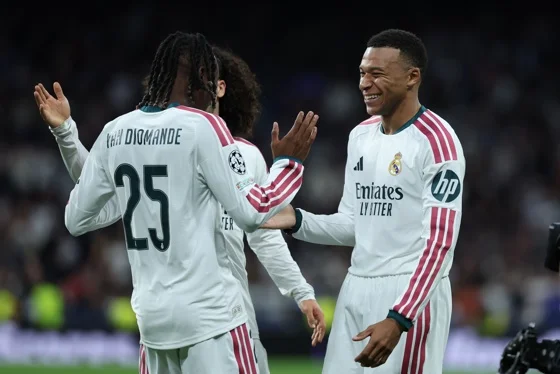 Real Madrid's Kylian Mbappe (R) celebrates after scoring during the UEFA Champions League soccer match between Real Madrid and RB Leipzig at Santiago Bernabeu stadium in Madrid, Spain. Oct. 21, 2026. EFE/EPA/Kiko Huesca